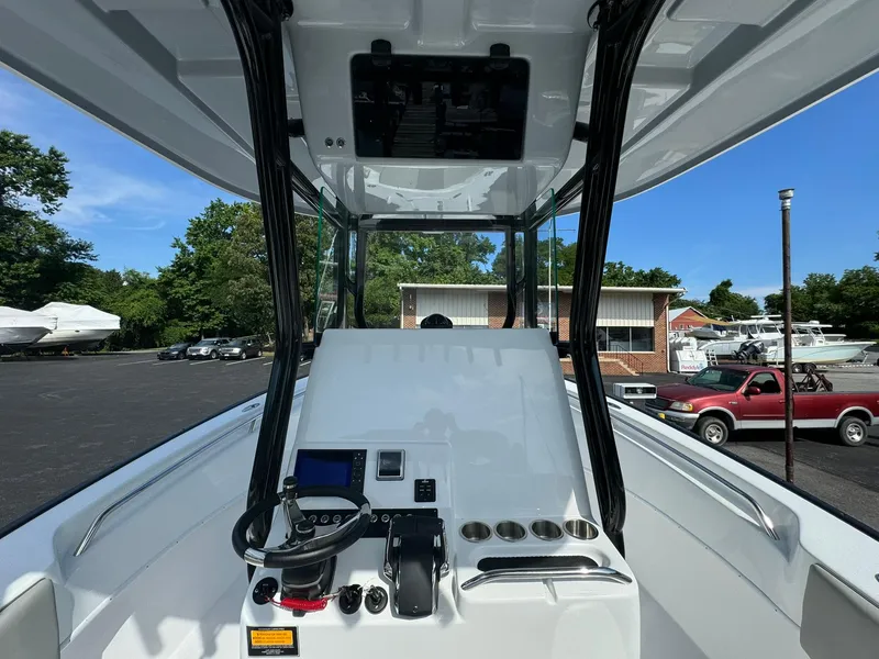 Slide: The Image of 2025 Cape Horn 27 XS boat cockpit with steering wheel and control panel. - 15