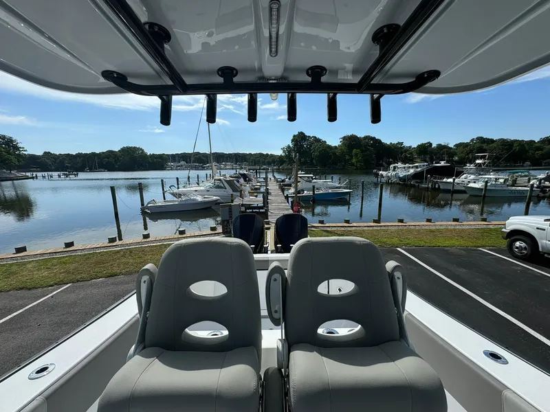 Slide: The Image of 2025 Cape Horn 27 XS boat interior with docked marina view. - 19