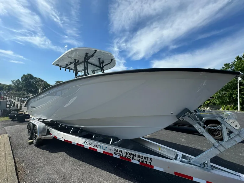 Slide: The Image of 2025 Cape Horn 27 XS boat on trailer under blue sky. - 3