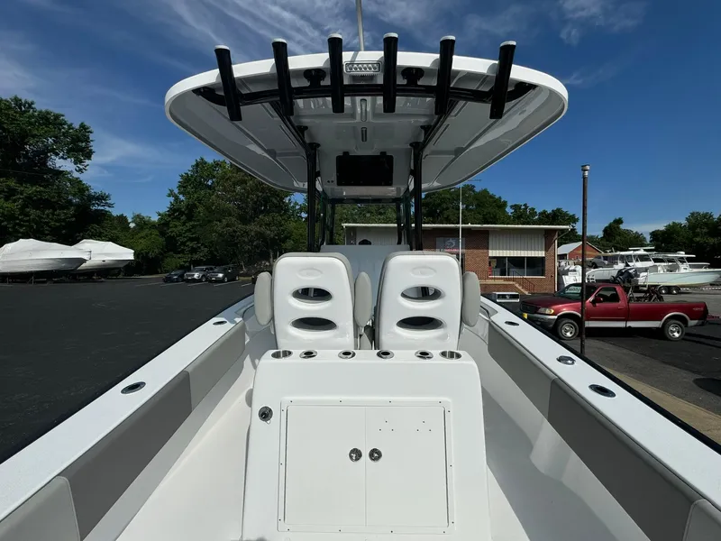 Slide: The Image of 2025 Cape Horn 27 XS boat interior with dual seats and rod holders. - 11