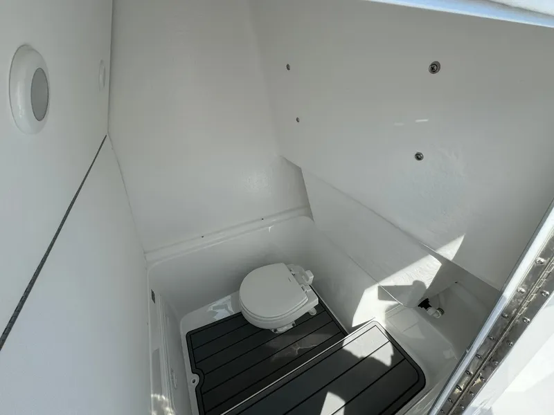 Slide: The Image of 2025 Cape Horn 27 XS boat interior with compact marine toilet. - 17