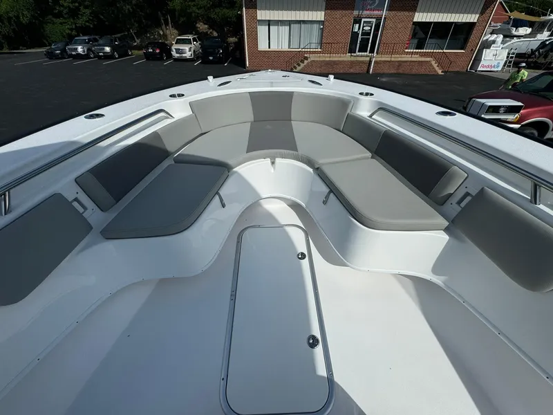 Slide: The Image of 2025 Cape Horn 27 XS boat interior with gray seating and spacious deck. - 20