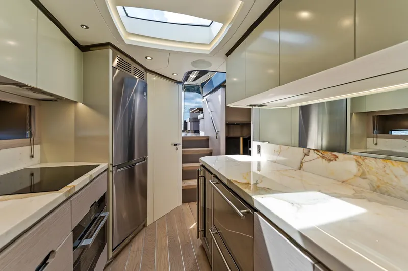 Slide: The Image of Luxurious interior of 2024 Uniesse Exuma HTC5p yacht with modern kitchen design. - 20