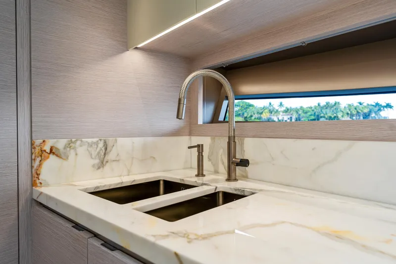 Slide: The Image of Luxurious marble sink in 2024 Uniesse Exuma HTC5p yacht kitchen. - 21