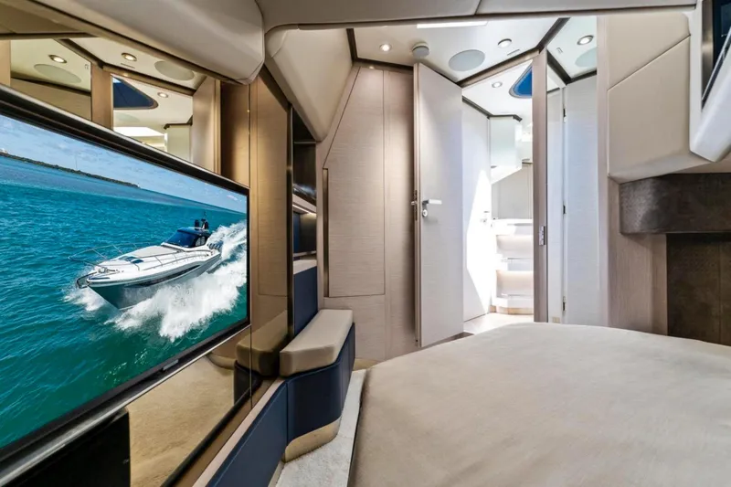 Slide: The Image of Luxurious interior of 2024 Uniesse Exuma HTC5p yacht with modern design and flat-screen TV. - 23