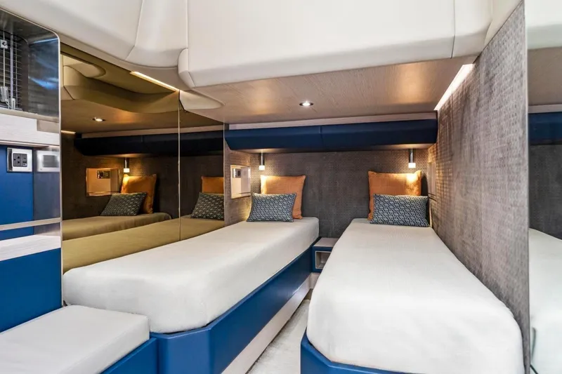 Slide: The Image of 2024 Uniesse Exuma HTC5p yacht interior with twin beds and modern design. - 24