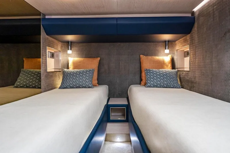 Slide: The Image of 2024 Uniesse Exuma HTC5p cabin with twin beds and modern lighting. - 26