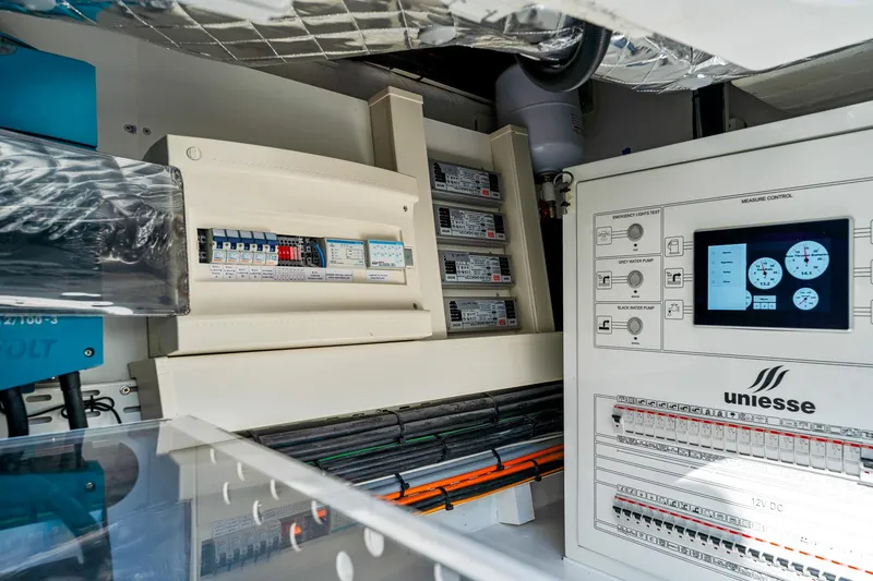 Slide: The Image of Electrical control panel of 2024 Uniesse Exuma HTC5p yacht, showcasing advanced systems and wiring. - 38