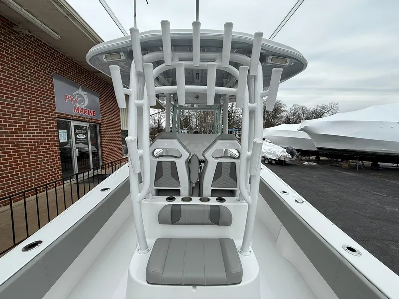 Slide: The Image of 2025 Cape Horn 28 XS boat with dual seats and T-top, displayed at a marine dealership. - 12