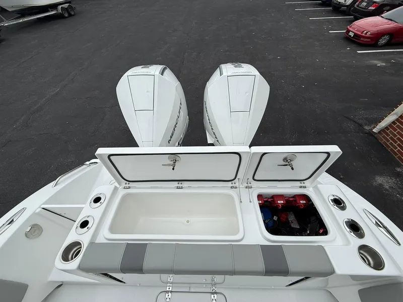 Slide: The Image of 2025 Cape Horn 28 XS boat with dual engines and storage compartments. - 17