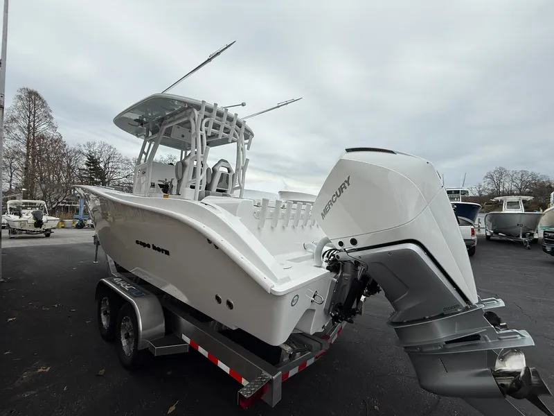 Slide: The Image of 2025 Cape Horn 28 XS boat on trailer with Mercury outboard engine. - 21
