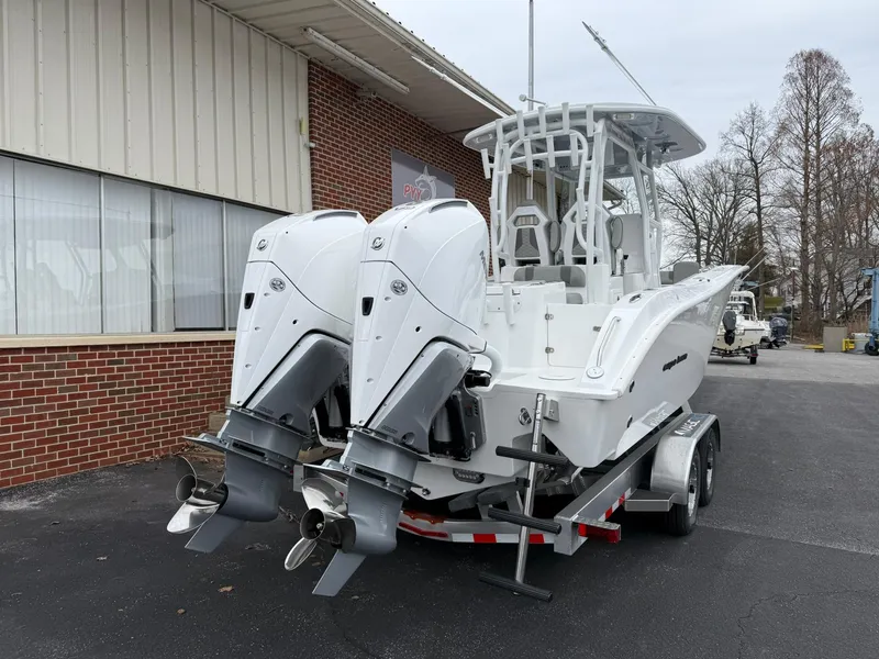 Slide: The Image of 2025 Cape Horn 28 XS boat with dual outboard engines on a trailer. - 23