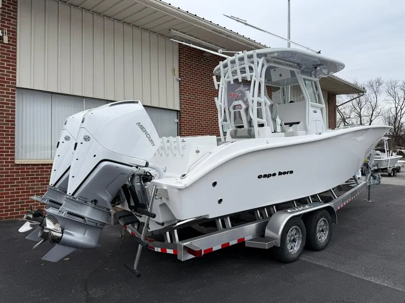 Slide: The Image of 2025 Cape Horn 28 XS boat on trailer, featuring dual Mercury outboard engines. - 24