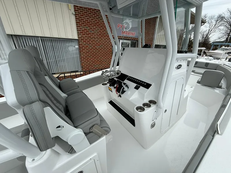 Slide: The Image of 2025 Cape Horn 28 XS boat interior with modern helm and seating. - 13