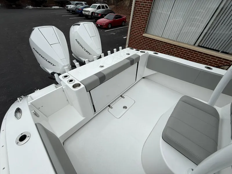 Slide: The Image of 2025 Cape Horn 28 XS boat with dual outboard engines and spacious seating. - 15