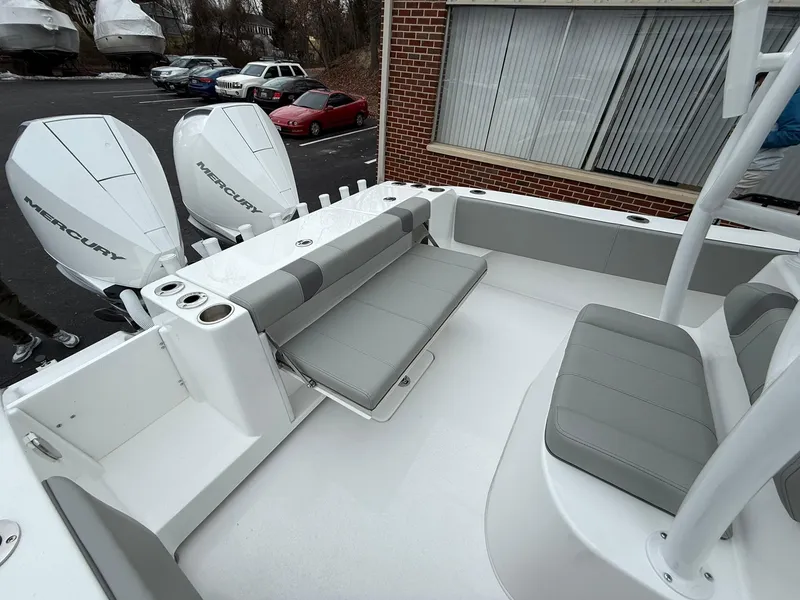 Slide: The Image of 2025 Cape Horn 28 XS boat interior with seating and dual Mercury engines. - 19