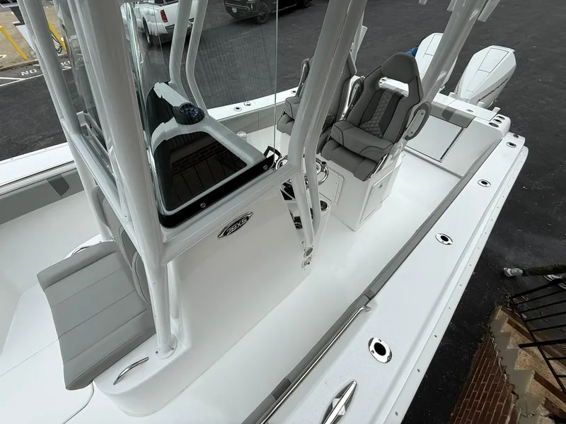 Slide: The Image of 2025 Cape Horn 28 XS boat interior with seating and console, showcasing modern design and functionality. - 8