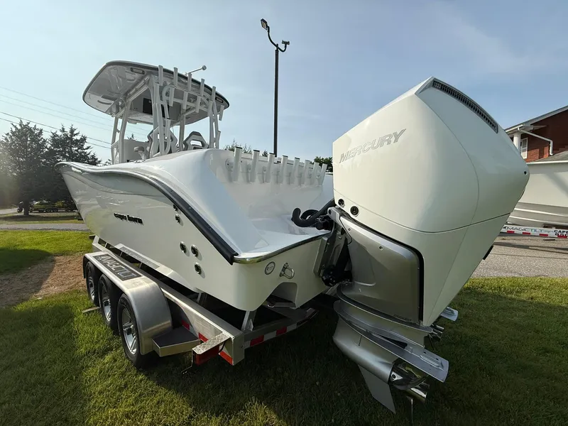 Slide: The Image of 2025 Cape Horn 32 XS boat on trailer with powerful outboard engine. - 5