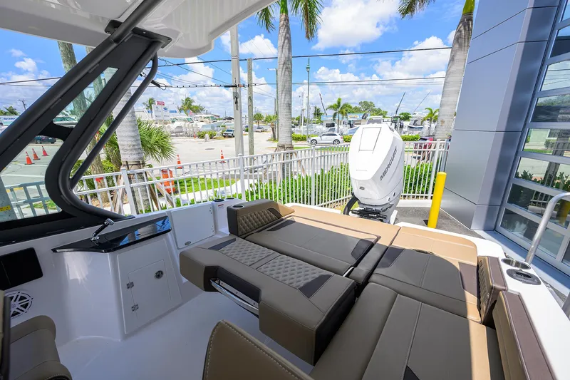 Slide: The Image of 2026 Monterey Elite 27 OB boat interior with luxurious seating and modern design. - 10