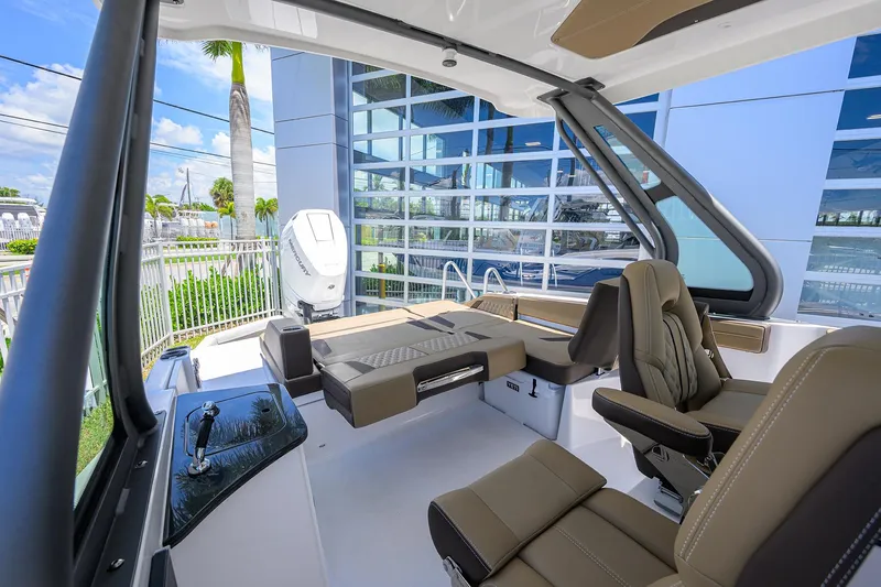 Slide: The Image of Luxurious interior of 2026 Monterey Elite 27 OB boat with modern seating and sleek design. - 11