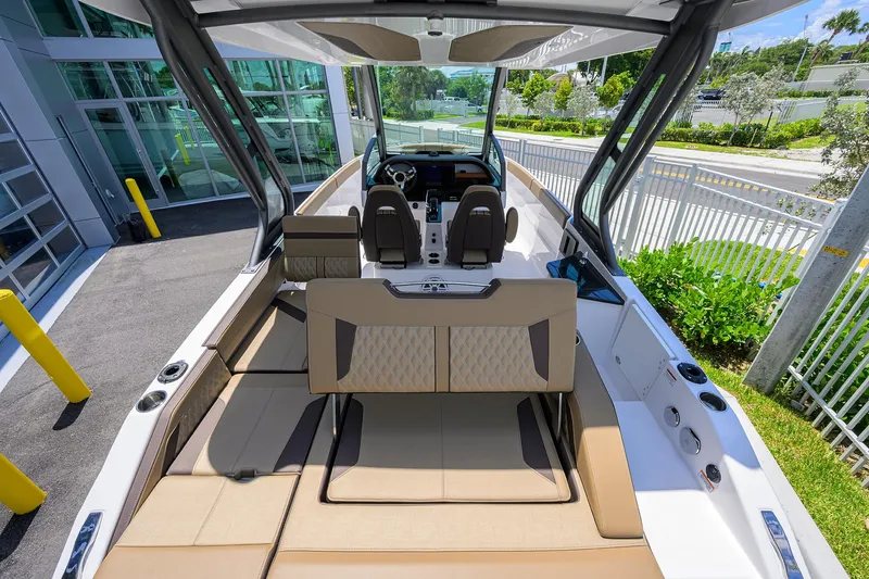 Slide: The Image of 2026 Monterey Elite 27 OB boat interior with luxurious seating and modern design. - 12