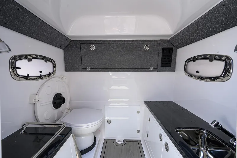 Slide: The Image of Interior of 2026 Monterey Elite 27 OB boat with modern bathroom amenities. - 20