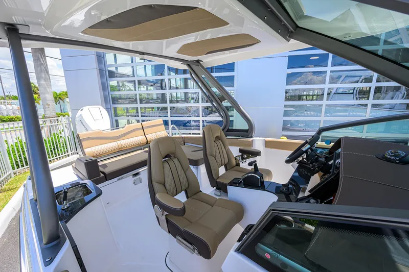Slide: The Image of Interior of 2026 Monterey Elite 27 OB boat with modern seating and controls. - 5