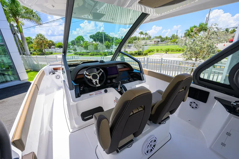 Slide: The Image of 2026 Monterey Elite 27 OB boat interior with modern dashboard and dual seats. - 7
