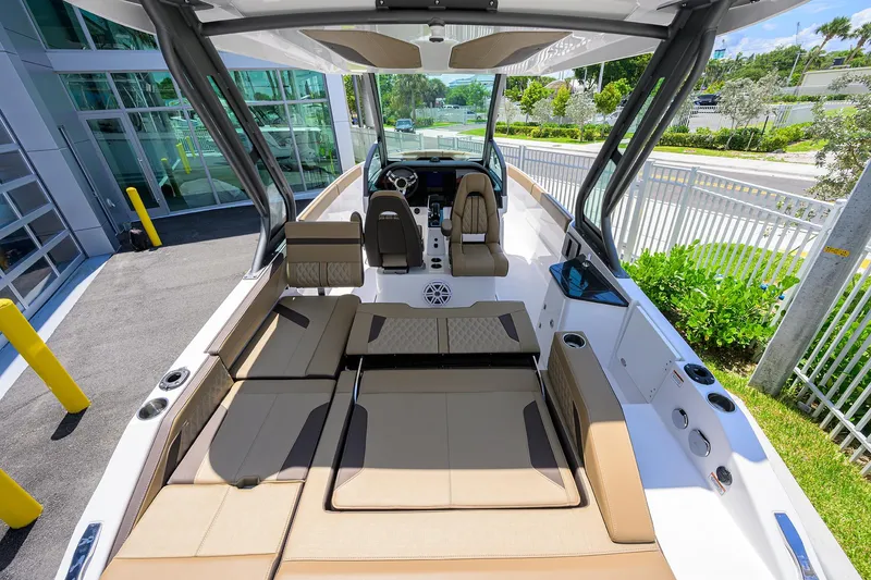 Slide: The Image of 2026 Monterey Elite 27 OB boat interior with luxurious seating and modern design. - 8