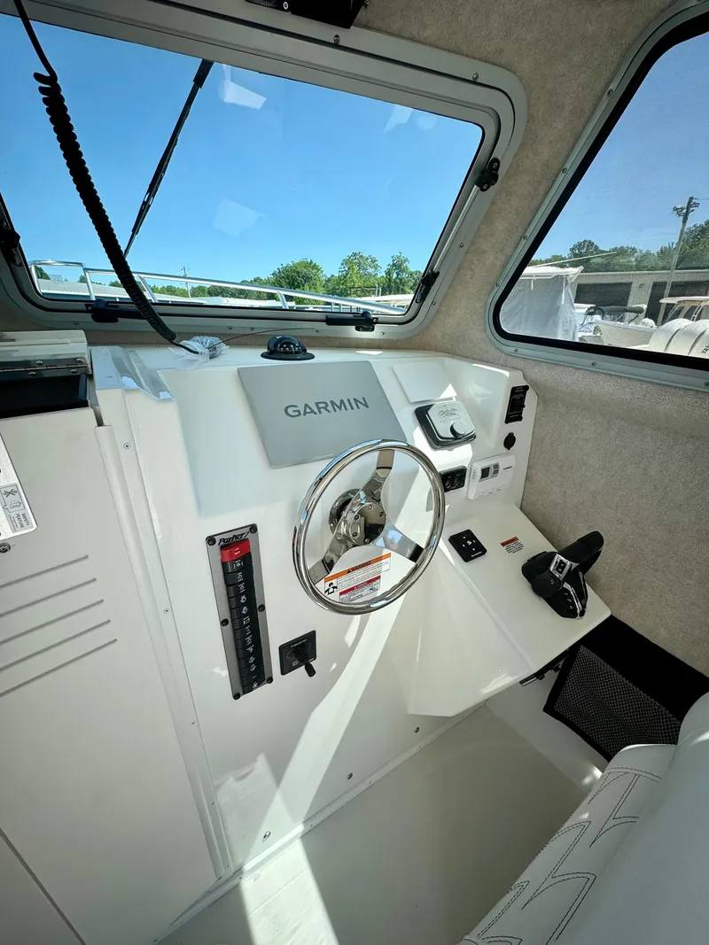 Slide: The Image of 2025 Parker 2820 XLD Sport Cabin helm with Garmin navigation system. - 11