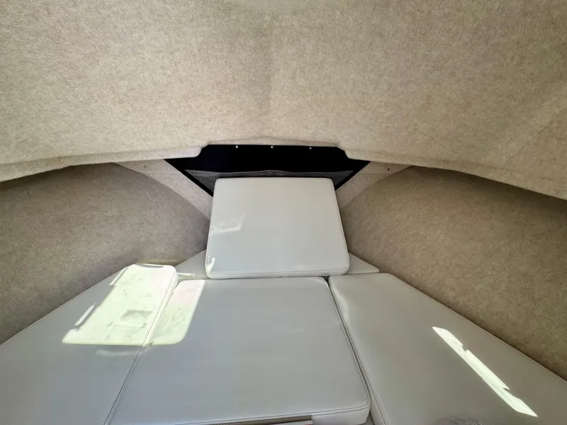 Slide: The Image of 2025 Parker 2820 XLD Sport Cabin interior with beige upholstery and cushioned seating. - 13