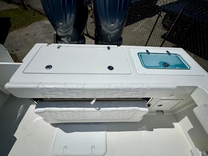 Slide: The Image of 2025 Parker 2820 XLD Sport Cabin boat deck with seating and storage compartments. - 6