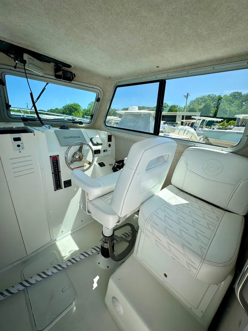 Slide: The Image of 2025 Parker 2820 XLD Sport Cabin interior with steering wheel and seating. - 9
