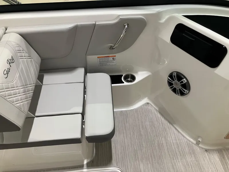 Slide: The Image of 2025 Sea Ray SDX 250 interior with cushioned seating and speaker system. - 7