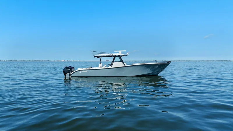 The Image of 2021 Yellowfin 39 boat on calm blue water under clear sky. - 0