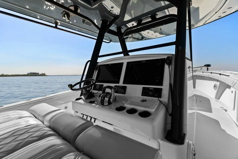 Slide: The Image of 2021 Yellowfin 39 boat cockpit with modern controls and ocean view. - 26