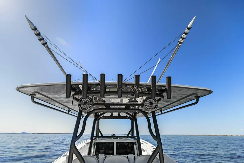 Slide: The Image of 2021 Yellowfin 39 boat with fishing rods on a calm sea under clear blue sky. - 29