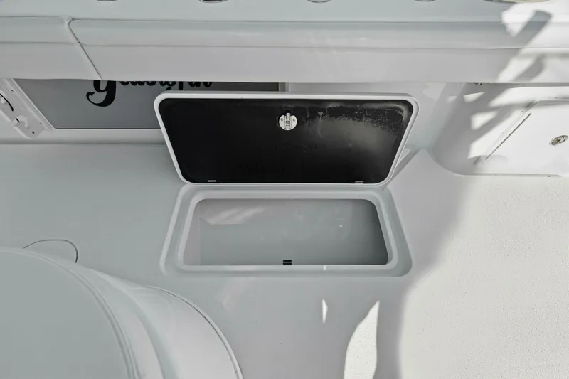 Slide: The Image of 2021 Yellowfin 39 boat storage compartment with open hatch, showcasing interior space. - 34