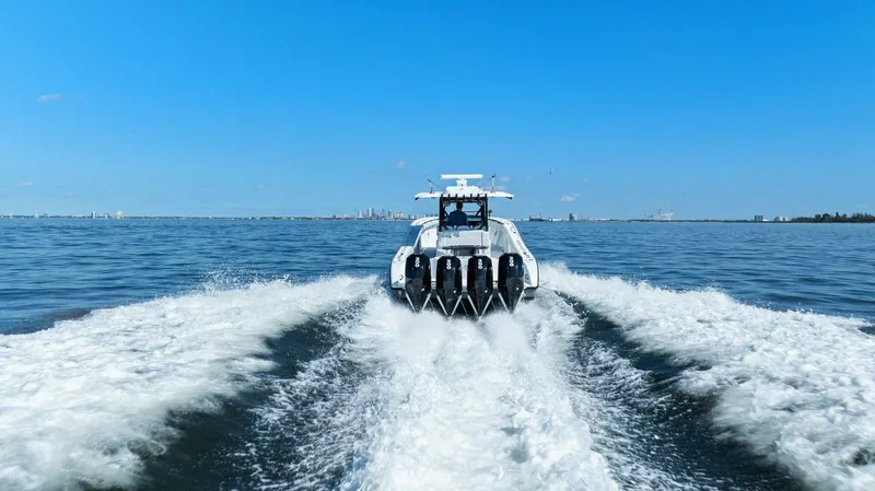 Slide: The Image of 2021 Yellowfin 39 boat cruising on open water with powerful engines. - 47