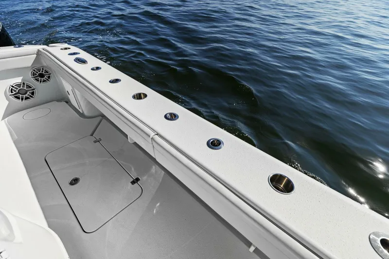 Slide: The Image of 2021 Yellowfin 39 boat deck with rod holders, speakers, and ocean view. - 6