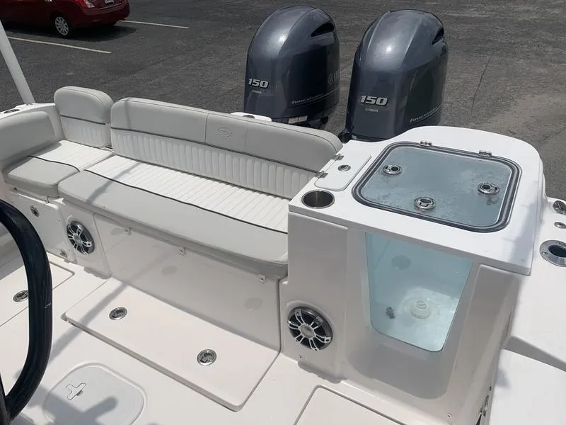 Slide: The Image of 2023 Sea Fox 268 Commander boat interior with seating and dual 150 horsepower engines. - 10