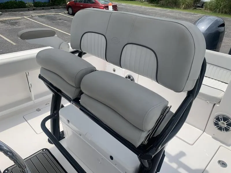 Slide: The Image of 2023 Sea Fox 268 Commander boat seating with cushioned backrests and armrests. - 14