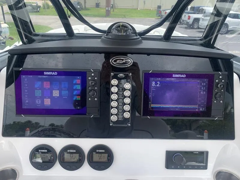 Slide: The Image of 2023 Sea Fox 268 Commander dashboard with dual Simrad displays and Yamaha gauges. - 17