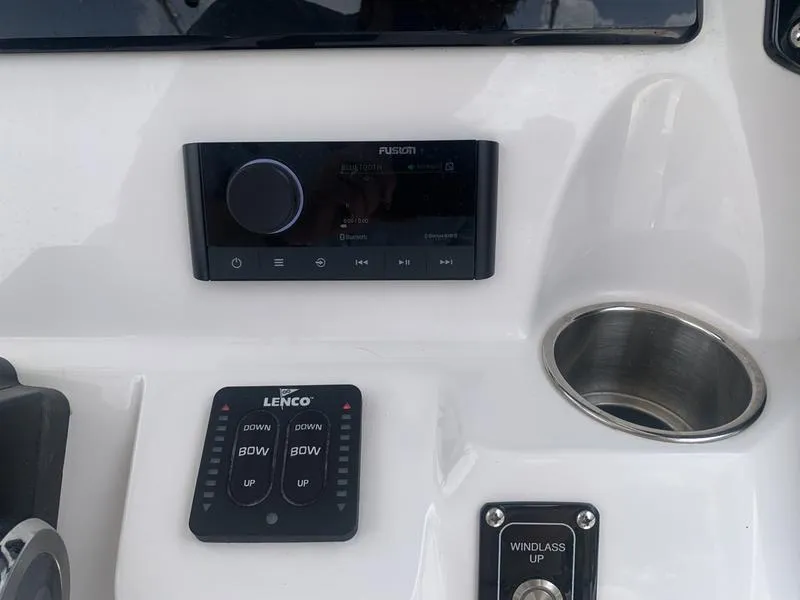Slide: The Image of Control panel of 2023 Sea Fox 268 Commander boat with audio system and cup holder. - 18