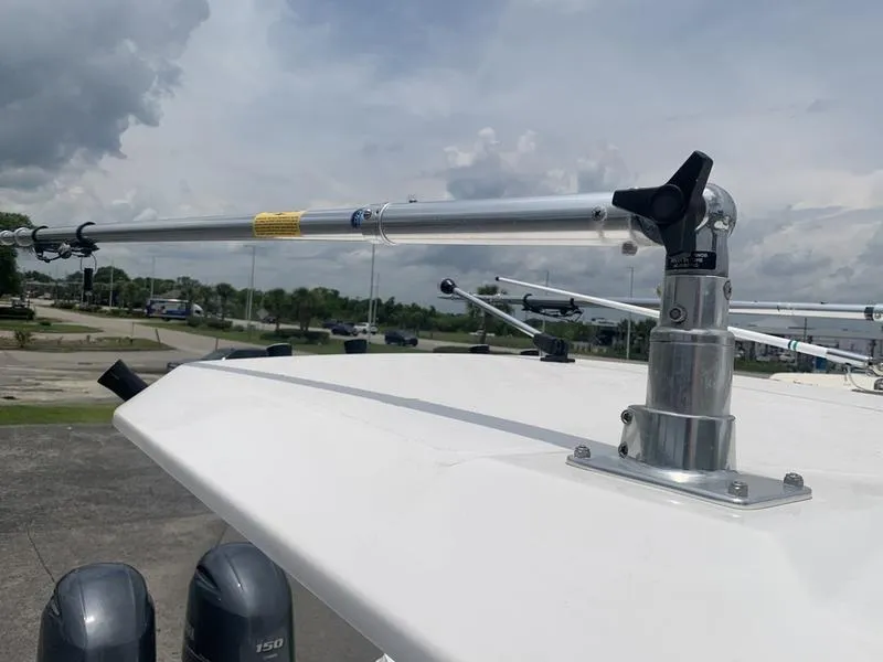 Slide: The Image of 2023 Sea Fox 268 Commander boat with mounted fishing outriggers under cloudy sky. - 22