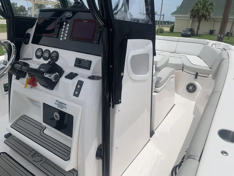 Slide: The Image of 2023 Sea Fox 268 Commander boat interior with modern dashboard and seating. - 23