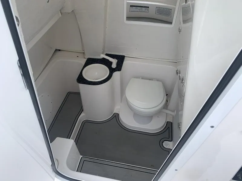 Slide: The Image of 2023 Sea Fox 268 Commander boat bathroom interior with toilet and sink. - 25