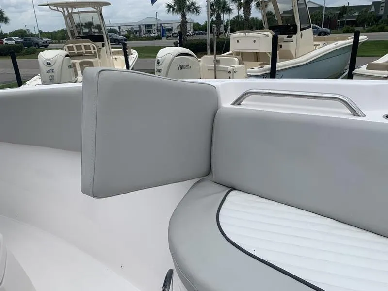 Slide: The Image of 2023 Sea Fox 268 Commander boat interior with cushioned seating and stainless steel handle. - 29