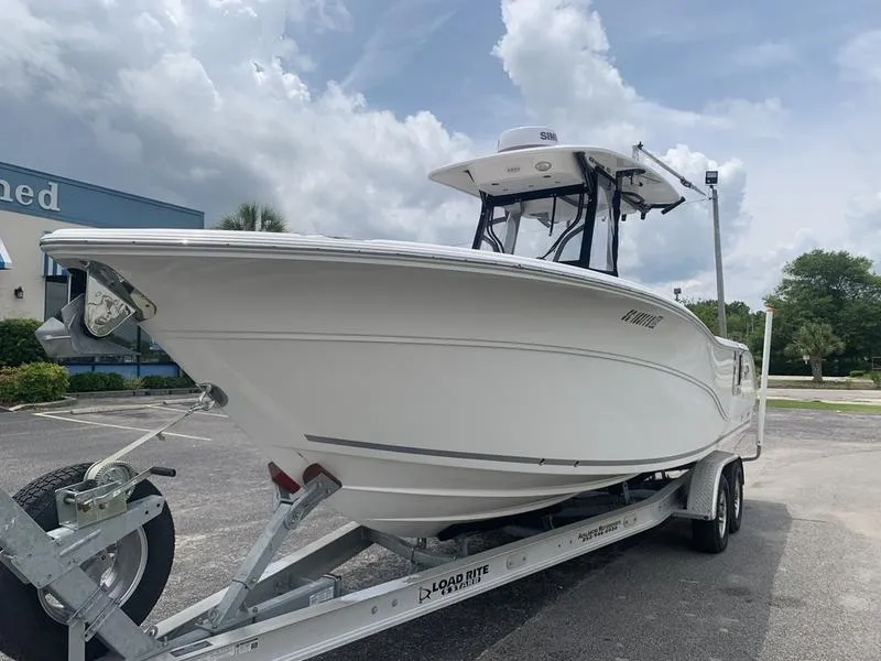 Slide: The Image of 2023 Sea Fox 268 Commander boat on trailer, parked outdoors under cloudy sky. - 8