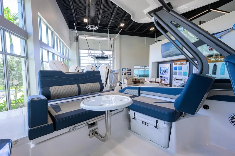 Slide: The Image of Luxurious interior of 2026 Monterey Elite 27 OB boat with blue seating and table. - 11